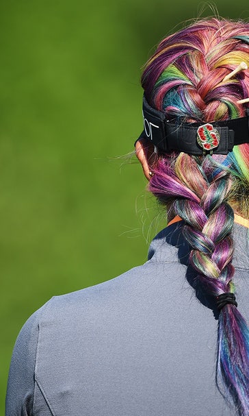 Michelle Wie is playing in a tournament with rainbow-colored hair